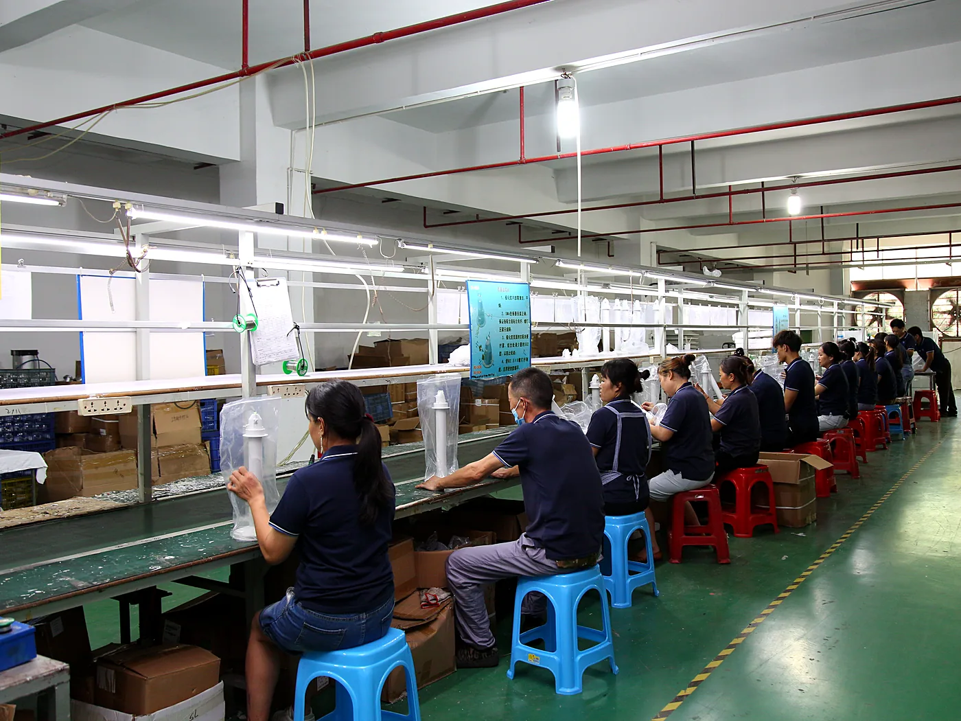 Assembly hall with rows of workstations
