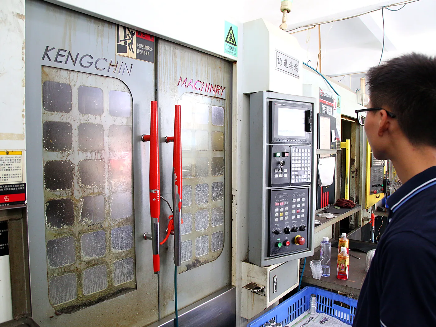 CNC vertical machining centre with operator at the control panel