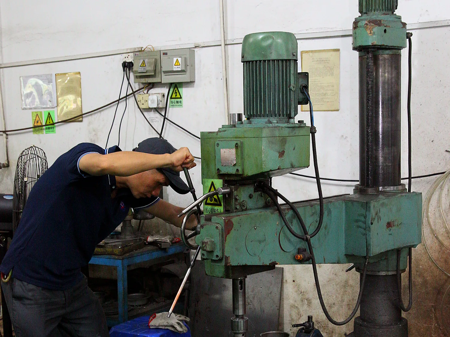 Technician setting up a die in a green press