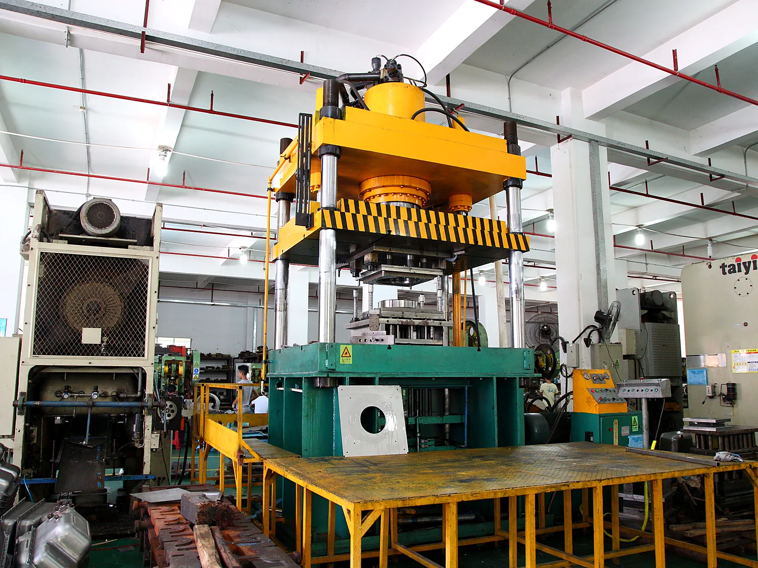 Press and die assembly on the shop floor