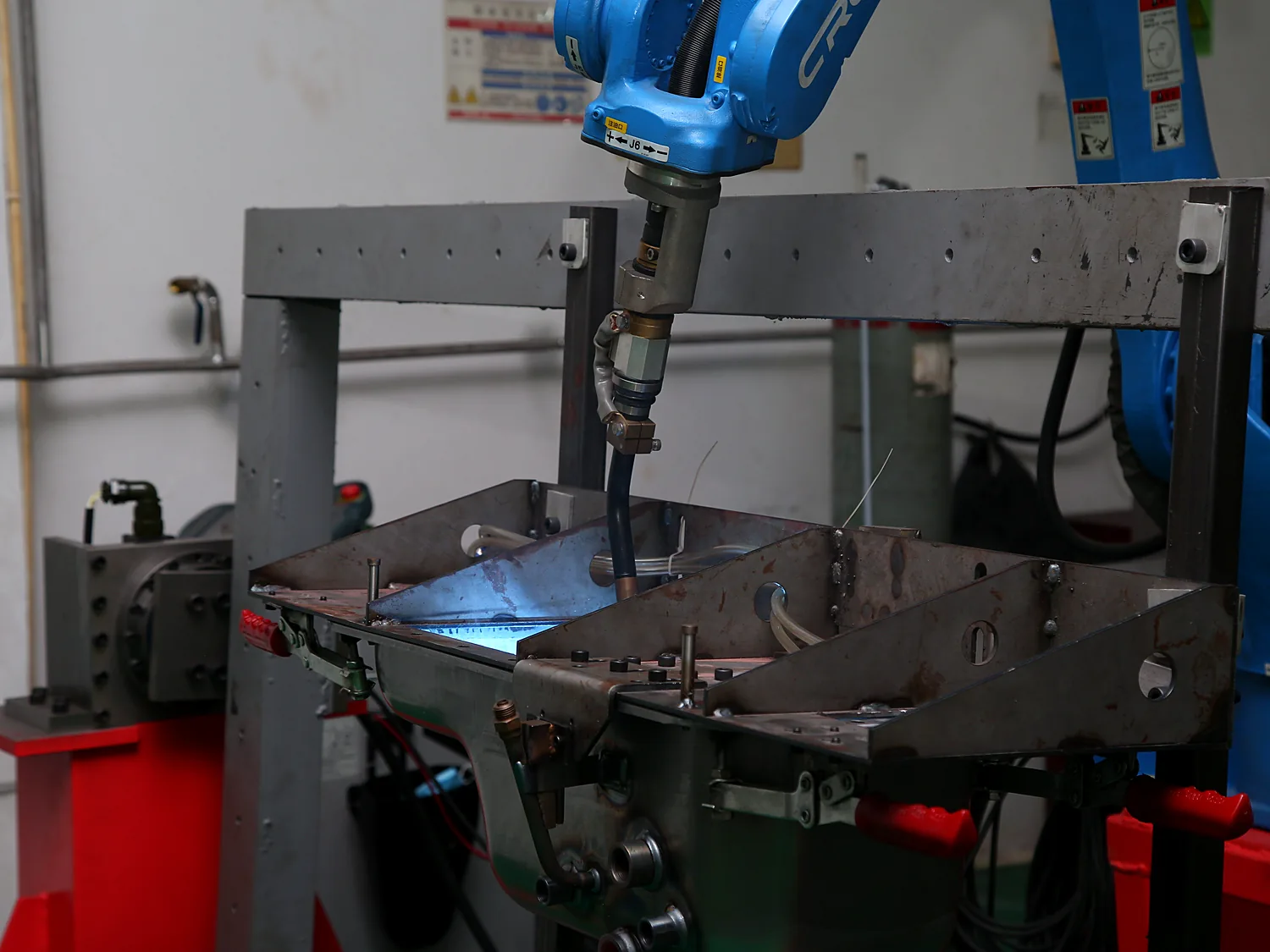 Wide view of the orange robotic welding line